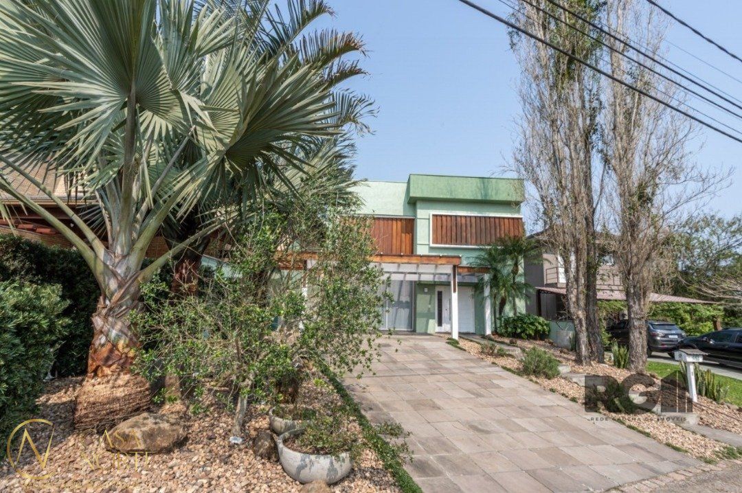 Casa de Condomínio à venda com 3 quartos, 261m², 3 suítes, 2 vagas, Avenida Juca Batista no bairro Belém Novo em Porto Alegre