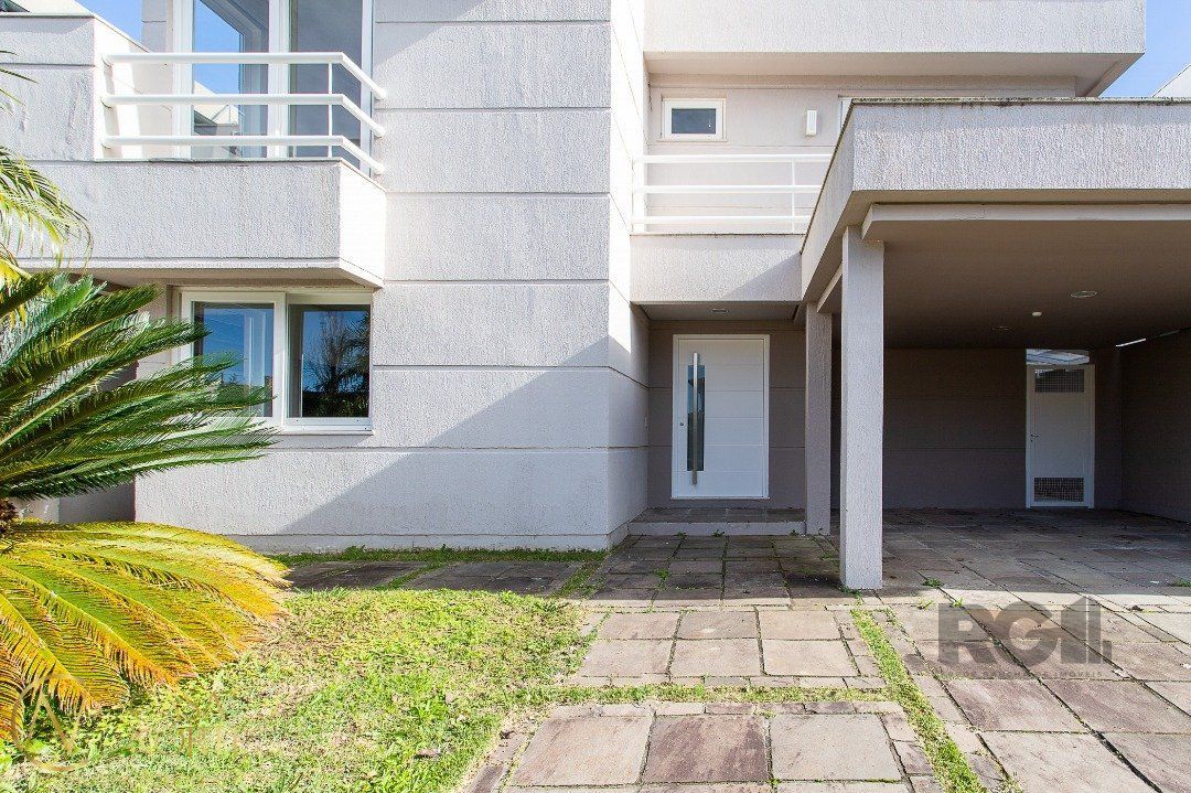 Casa de Condomínio à venda com 4 quartos, 455m², 4 suítes, 4 vagas, Avenida Juca Batista no bairro Belém Novo em Porto Alegre
