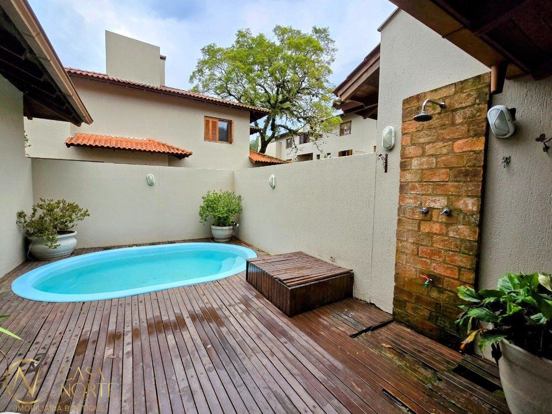 Casa de Condomínio à venda com 4 quartos, 299m², 2 suítes, 3 vagas, Travessa Pedra Redonda no bairro Jardim Isabel em Porto Alegre