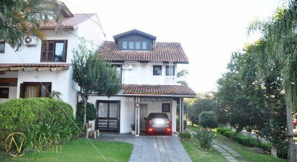 Casa de Condomínio à venda com 3 quartos, 175m², 1 suíte, 2 vagas, Avenida Eduardo Prado no bairro Cavalhada em Porto Alegre