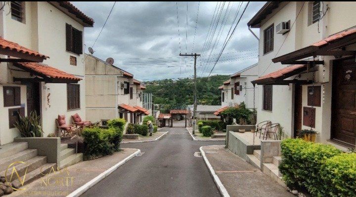 Casa de Condomínio à venda com 3 quartos, 80m², 1 vaga, Avenida Monte Cristo no bairro Vila Nova em Porto Alegre