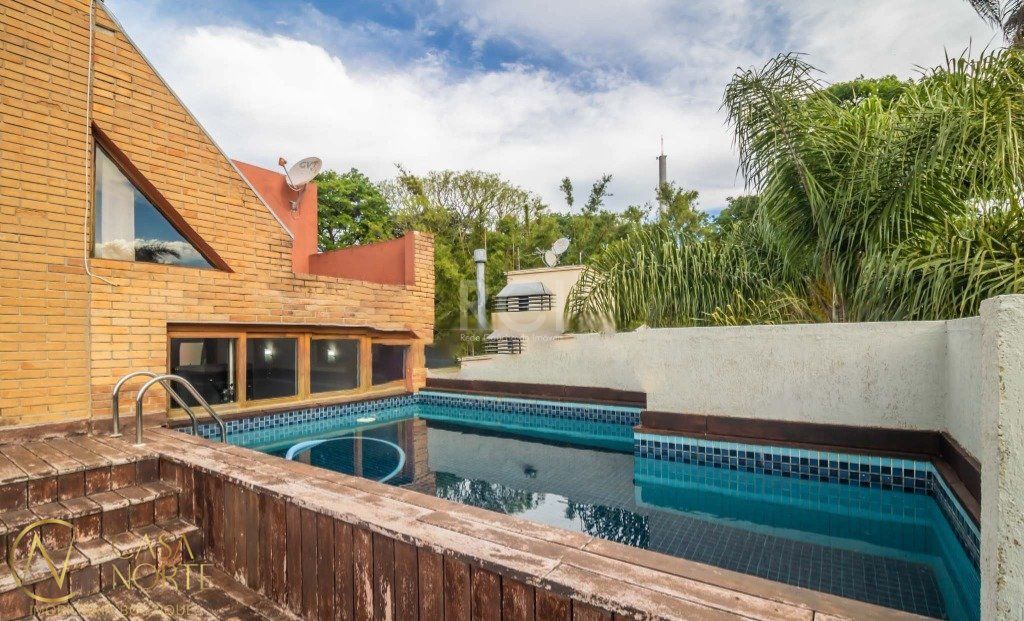 Casa de Condomínio à venda com 3 quartos, 381m², 1 suíte, 2 vagas, Rua Silveiro no bairro Menino Deus em Porto Alegre