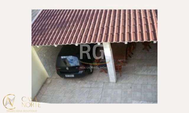 Casa à venda com 3 quartos, 185m², 3 vagas, Rua Guaracapa no bairro Santa Maria Goretti em Porto Alegre