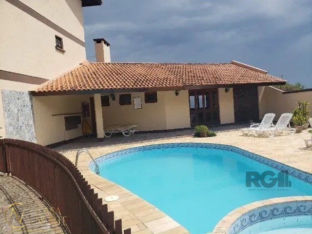 Casa de Condomínio à venda com 2 quartos, 179m², 1 suíte, 2 vagas, Avenida Wenceslau Escobar no bairro Tristeza em Porto Alegre