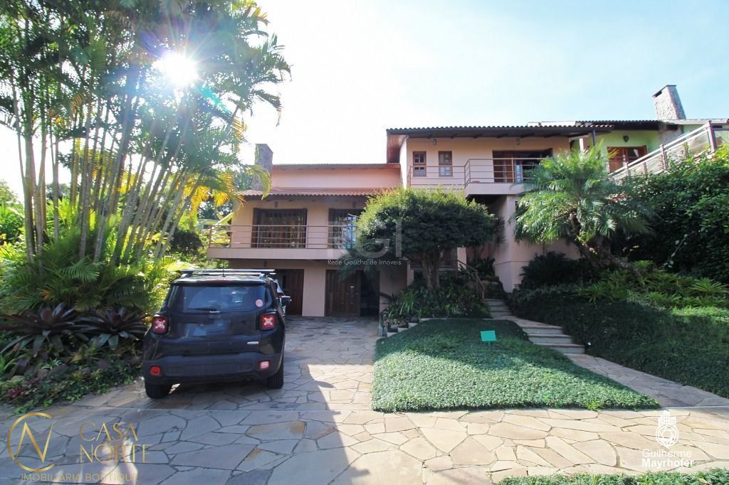Casa à venda com 5 quartos, 420m², 2 suítes, 6 vagas, Avenida Firmino Octavio Bimbi no bairro Cavalhada em Porto Alegre