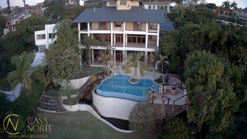 Casa à venda com 4 quartos, 1107m², 4 suítes, 8 vagas, Rua Bororo no bairro Vila Assunção em Porto Alegre