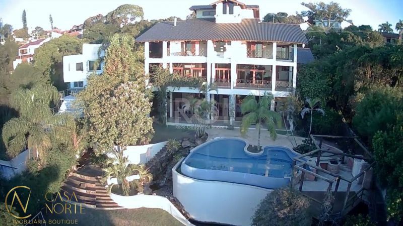 Casa à venda com 4 quartos, 1107m², 4 suítes, 8 vagas, Rua Bororo no bairro Vila Assunção em Porto Alegre