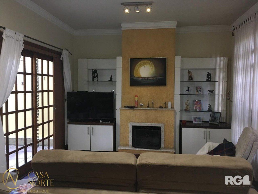 Casa à venda com 4 quartos, 243m², 1 suíte, 2 vagas, Rua Abdo Jorge Curi no bairro Parque Santa Fé em Porto Alegre