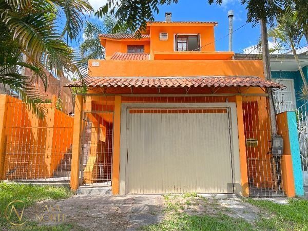 Casa à venda com 2 quartos, 144m², 2 vagas, Rua Orquidea no bairro Lomba do Pinheiro em Porto Alegre