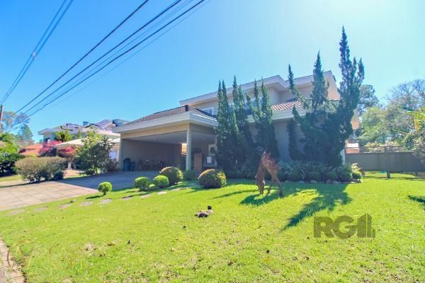Casa de Condomínio à venda com 4 quartos, 405m², 4 suítes, 1 vaga, Avenida Juca Batista no bairro Chapéu do Sol em Porto Alegre