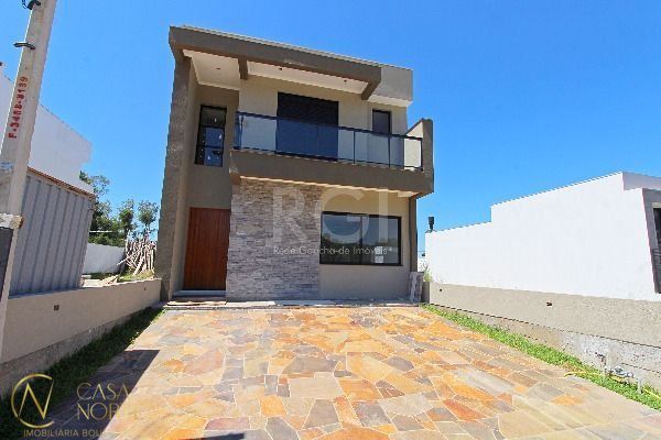 Casa à venda com 3 quartos, 152m², 2 suítes, 2 vagas, Rua João Otto Paiva no bairro Hípica em Porto Alegre