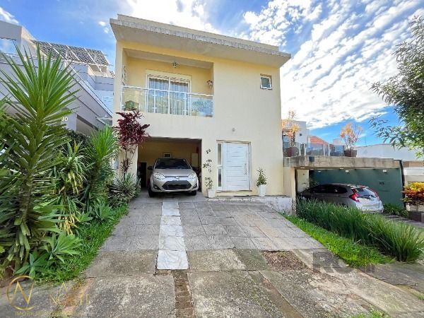 Casa de Condomínio à venda com 3 quartos, 194m², 1 suíte, Rua Adriano Pereira da Silva no bairro Vila Nova em Porto Alegre