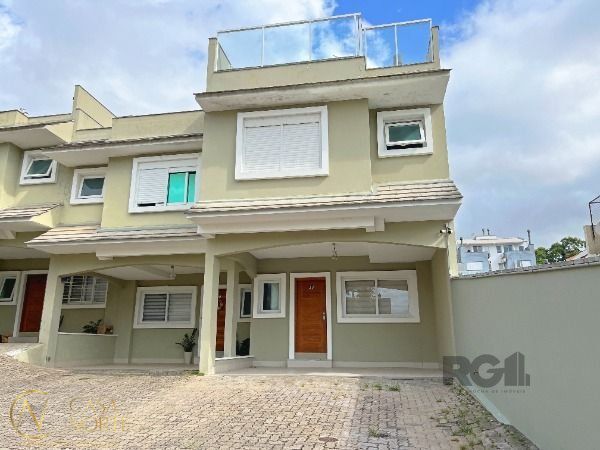 Casa de Condomínio à venda com 4 quartos, 210m², 3 suítes, 2 vagas, Rua Doutor Mário Totta no bairro Tristeza em Porto Alegre