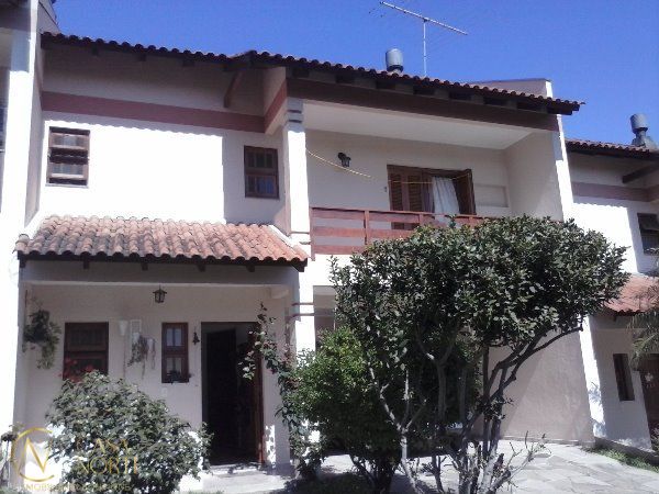 Casa de Condomínio à venda com 3 quartos, 239m², 1 suíte, 2 vagas, Avenida da Cavalhada no bairro Cavalhada em Porto Alegre