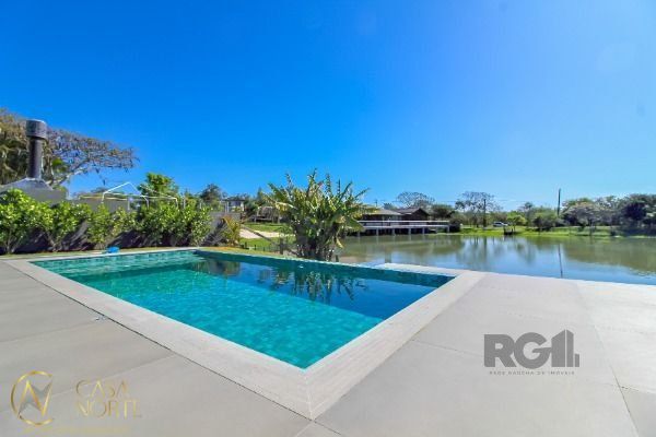 Casa de Condomínio à venda com 4 quartos, 450m², 4 suítes, 2 vagas, Avenida Juca Batista no bairro Belém Novo em Porto Alegre
