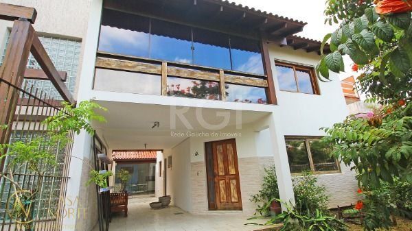 Casa à venda com 3 quartos, 177m², 1 suíte, 2 vagas, Rua Canisio Binsfeld no bairro Hípica em Porto Alegre