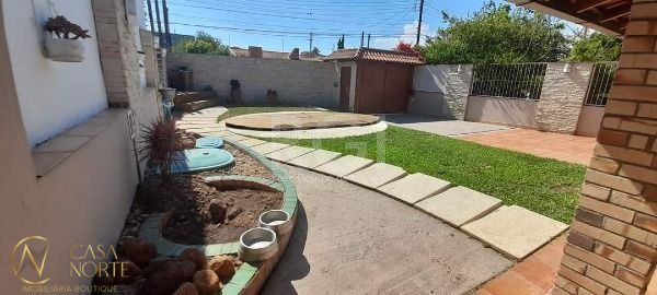 Casa à venda com 4 quartos, 374m², 1 suíte, 3 vagas, Rua Oiampi no bairro Guarujá em Porto Alegre