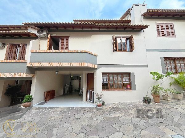 Casa de Condomínio à venda com 3 quartos, 128m², 1 suíte, 1 vaga, Rua dos Caiaguais no bairro Espírito Santo em Porto Alegre