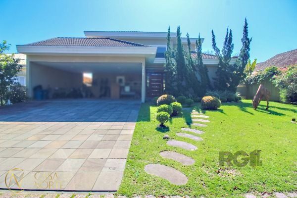 Casa de Condomínio à venda com 4 quartos, 405m², 4 suítes, 1 vaga, Avenida Juca Batista no bairro Chapéu do Sol em Porto Alegre