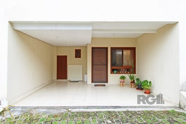 Casa de Condomínio à venda com 2 quartos, 133m², 2 vagas, Rua Liberal no bairro Tristeza em Porto Alegre