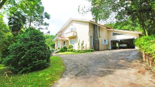 Casa de Condomínio à venda com 3 quartos, 348m², 3 suítes, 3 vagas, Avenida Professor Oscar Pereira no bairro Cascata em Porto Alegre