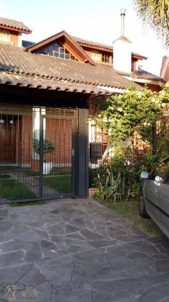 Casa à venda com 5 quartos, 254m², 1 suíte, 4 vagas, Rua Adao Pinheiro da Silva no bairro Aberta dos Morros em Porto Alegre