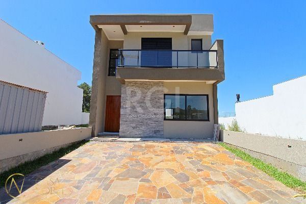 Casa à venda com 3 quartos, 152m², 2 suítes, 2 vagas, Rua João Otto Paiva no bairro Hípica em Porto Alegre
