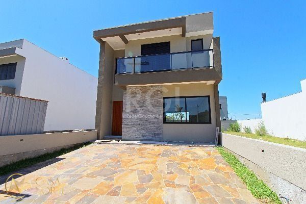 Casa à venda com 3 quartos, 152m², 2 suítes, 2 vagas, Rua João Otto Paiva no bairro Hípica em Porto Alegre