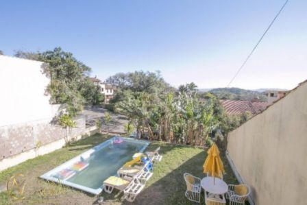 Casa à venda com 4 quartos, 450m², 3 suítes, 4 vagas, Rua Edgar Luiz Schneider no bairro Ipanema em Porto Alegre
