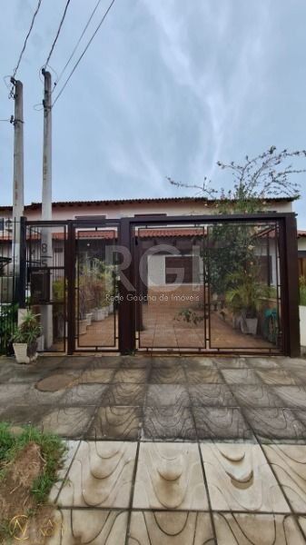 Casa à venda com 2 quartos, 100m², 1 suíte, 1 vaga, Rua Hilario Gonçalves Pinha no bairro Hípica em Porto Alegre