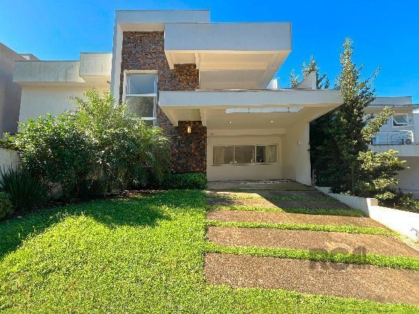 Casa de Condomínio à venda com 3 quartos, 256m², 3 suítes, 2 vagas, Rua Francisco Solano Borges no bairro Hípica em Porto Alegre