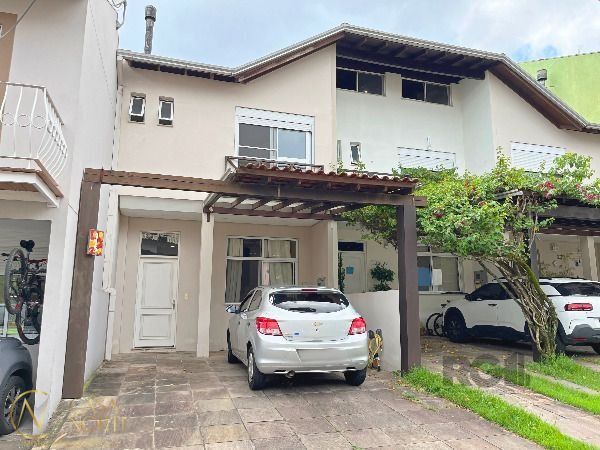 Casa de Condomínio à venda com 3 quartos, 159m², 1 suíte, 2 vagas, Estrada João Salomoni no bairro Vila Nova em Porto Alegre