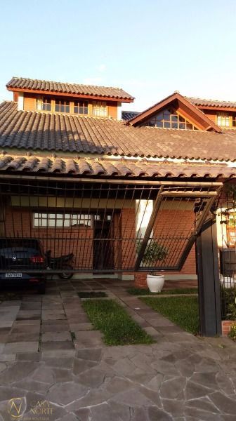 Casa à venda com 5 quartos, 254m², 1 suíte, 4 vagas, Rua Adao Pinheiro da Silva no bairro Aberta dos Morros em Porto Alegre