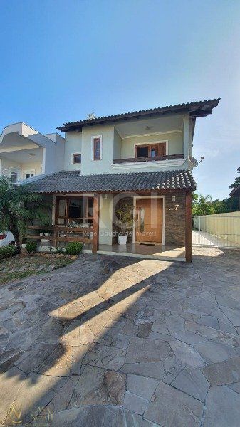 Casa de Condomínio à venda com 3 quartos, 221m², 1 suíte, 3 vagas, Edgar Pires de Castro no bairro Hípica em Porto Alegre