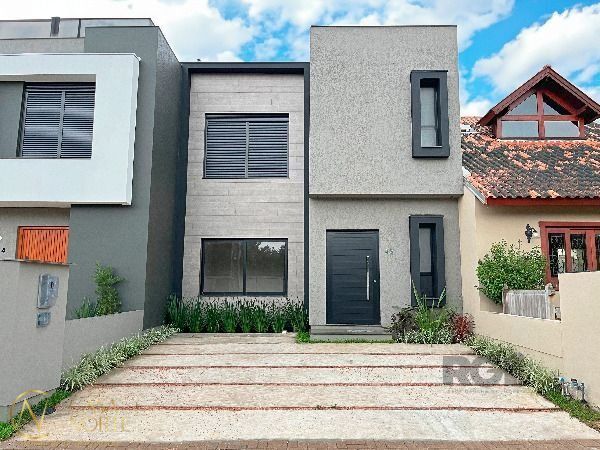 Casa de Condomínio à venda com 3 quartos, 136m², 1 suíte, 2 vagas, Rua Jean Vardaramatos no bairro Hípica em Porto Alegre