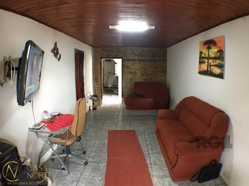 Casa à venda com 2 quartos, 150m², 1 vaga, Rua Professor Rubens Guelli no bairro Vila Nova em Porto Alegre