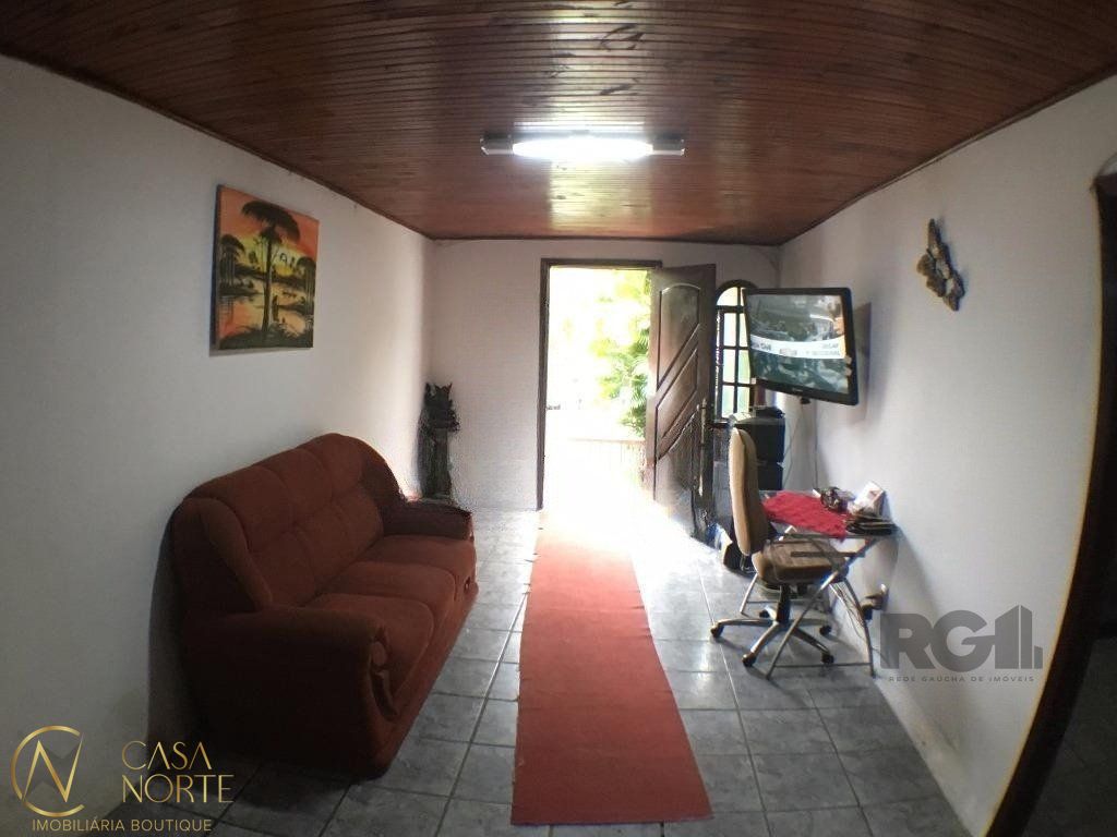 Casa à venda com 2 quartos, 150m², 1 vaga, Rua Professor Rubens Guelli no bairro Vila Nova em Porto Alegre