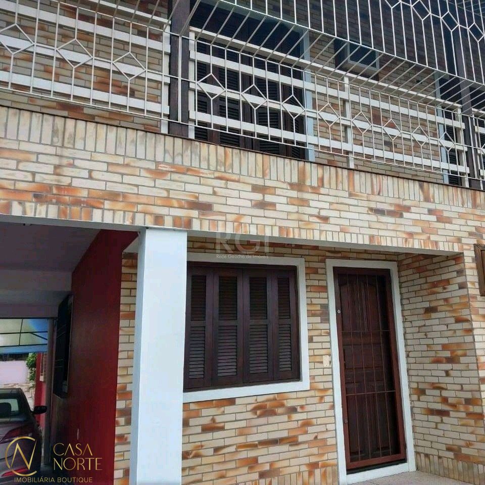 Casa à venda com 4 quartos, 320m², 2 vagas, Rua Miguel Ascoleze no bairro Vila Nova em Porto Alegre