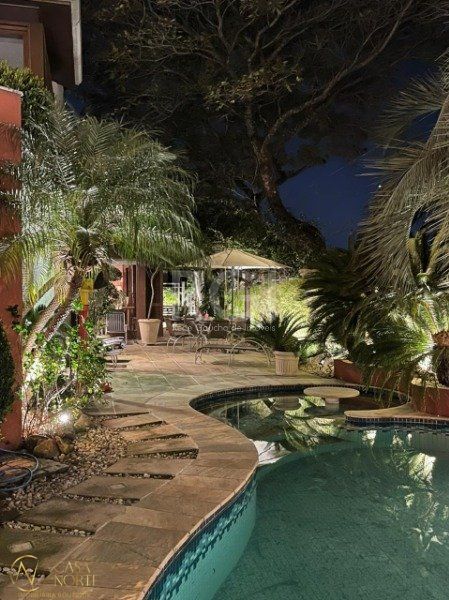 Casa de Condomínio à venda com 4 quartos, 420m², 4 suítes, 2 vagas, Rua Gustavo Schmidt no bairro Três Figueiras em Porto Alegre