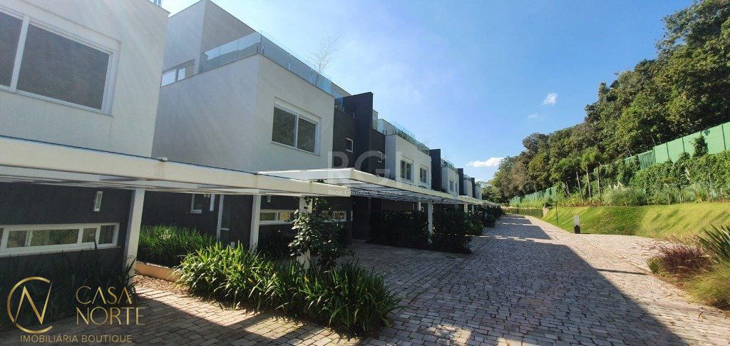 Casa de Condomínio à venda com 3 quartos, 459m², 3 suítes, 3 vagas, Rua Doutor Ney de Castilhos Ferreira no bairro Pedra Redonda em Porto Alegre