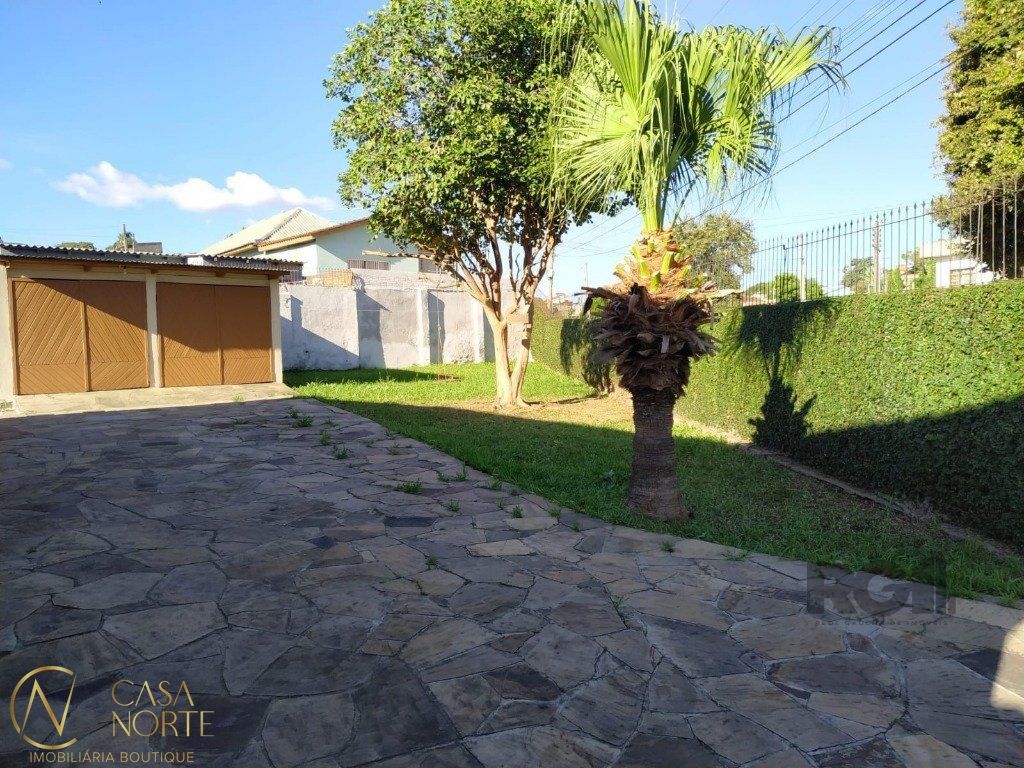 Casa à venda com 3 quartos, 143m², 2 vagas, Rua Amália Figueiroa no bairro Partenon em Porto Alegre