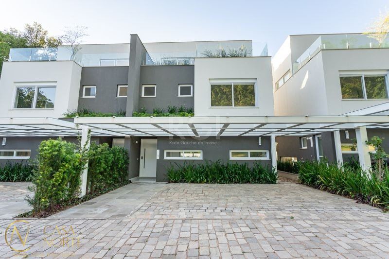 Casa de Condomínio à venda com 3 quartos, 459m², 3 suítes, 3 vagas, Rua Doutor Ney de Castilhos Ferreira no bairro Pedra Redonda em Porto Alegre