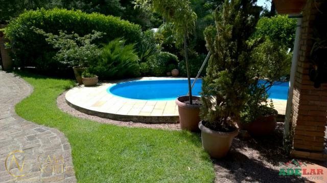 Casa à venda com 4 quartos, 254m², 3 vagas, Rua Pedro de Oliveira Franca no bairro Hípica em Porto Alegre