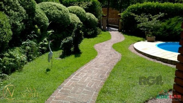 Casa à venda com 4 quartos, 254m², 3 vagas, Rua Pedro de Oliveira Franca no bairro Hípica em Porto Alegre