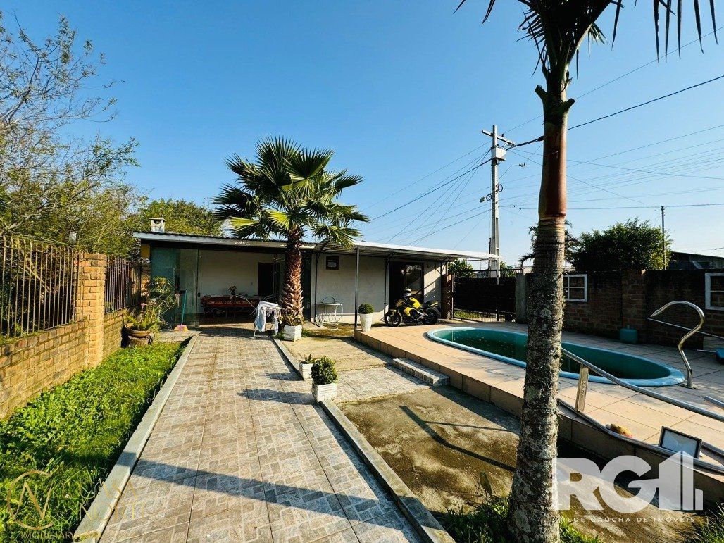 Casa à venda com 3 quartos, 136m², 1 suíte, 3 vagas, Estrada Otaviano José Pinto no bairro Lami em Porto Alegre