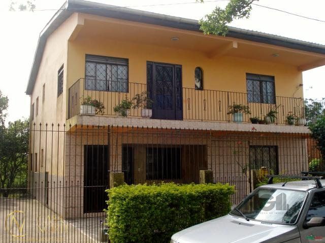 Casa à venda com 5 quartos, 1162m², 3 vagas, Rua Laranjeiras no bairro Restinga em Porto Alegre