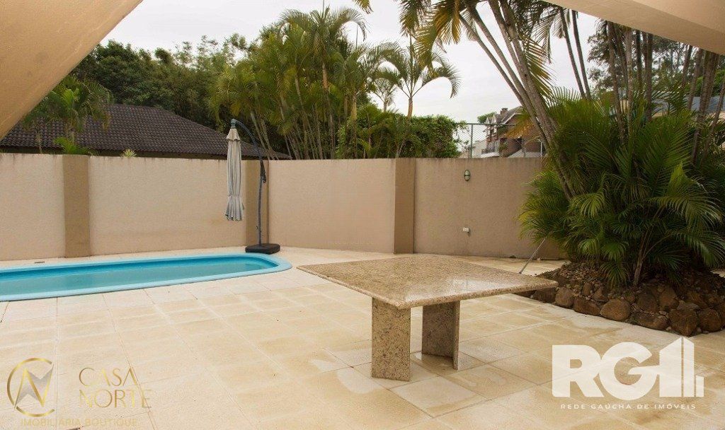 Casa de Condomínio à venda com 4 quartos, 440m², 2 vagas, Rua Tocantins no bairro Lomba do Pinheiro em Porto Alegre