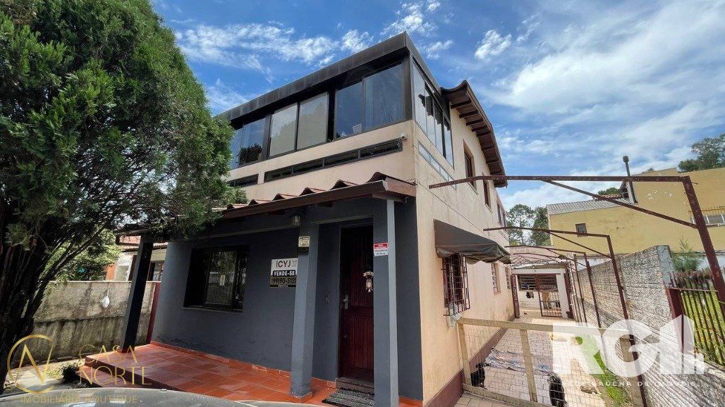Casa à venda com 3 quartos, 450m², 1 suíte, 2 vagas, Rua Bogotá no bairro Jardim Lindóia em Porto Alegre