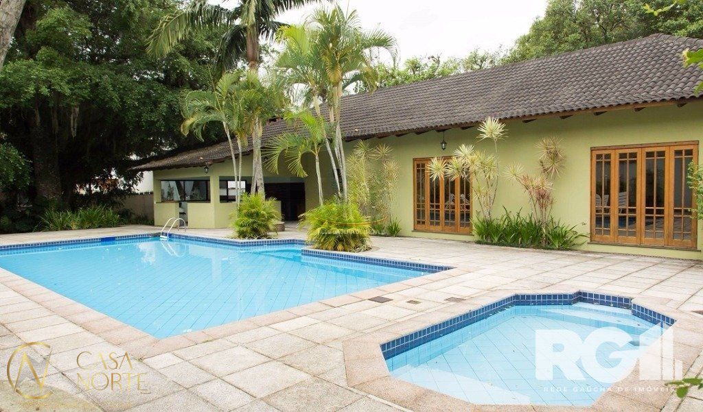 Casa de Condomínio à venda com 4 quartos, 440m², 2 vagas, Rua Tocantins no bairro Lomba do Pinheiro em Porto Alegre