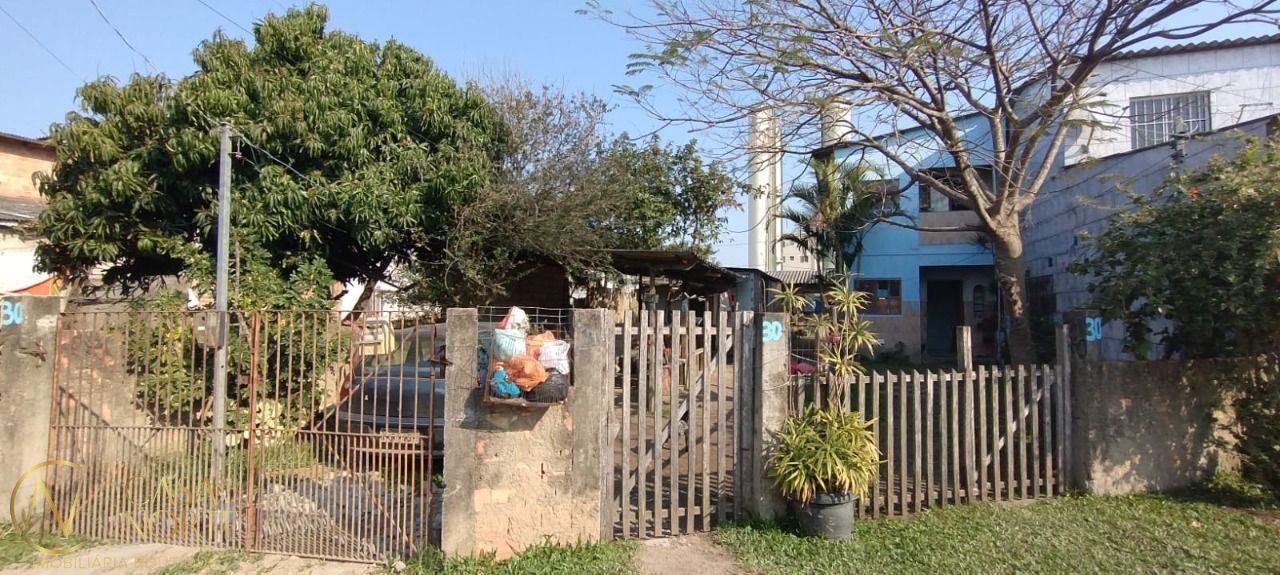 Casa à venda com 5 quartos, 100m², 1 vaga, Rua Sete Mil e Quatro no bairro Restinga em Porto Alegre